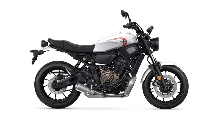 A sleek, modern motorcycle in white with black accents, featuring a prominent Yamaha logo, a low-slung seat, and dual exhaust pipes, viewed from the side.