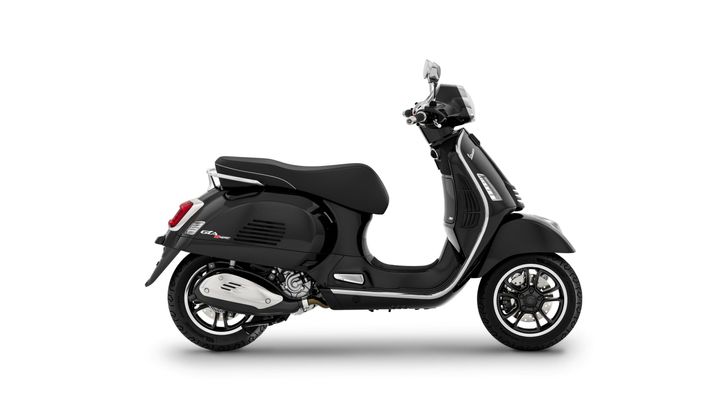 A sleek black scooter viewed from the side, showcasing its modern design and chrome accents.