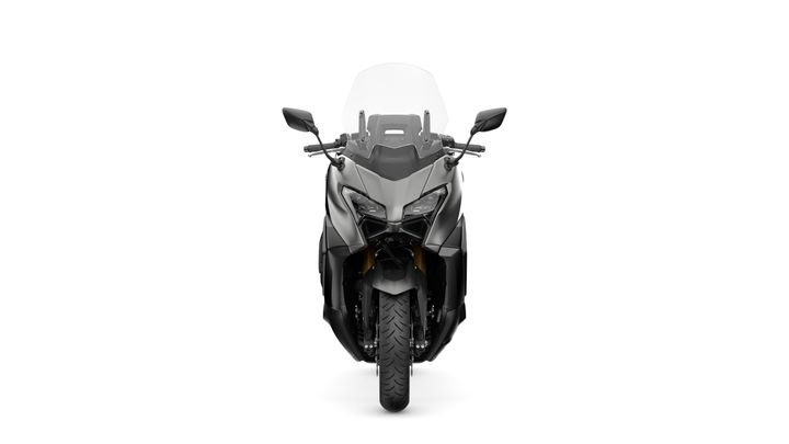 A front view of a sleek black motorcycle with a transparent windshield, showcasing its angular design and prominent wheel.
