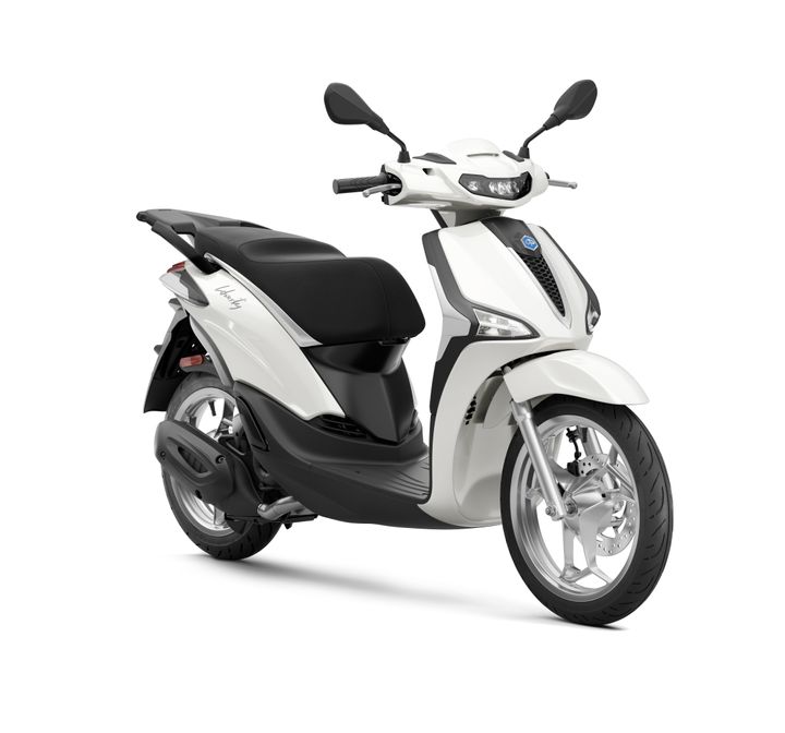 A sleek white scooter with a black seat, featuring a streamlined body, two mirrors, and silver wheels, shown at a slight angle.