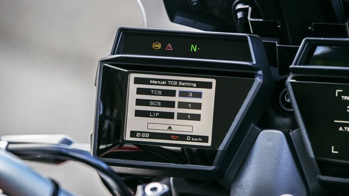 A motorcycle dashboard display showing manual traction control settings, with TCS set to 3, SCS to 1, and LIF to 1, along with an oil indicator and speed reading of 0 km/h. The time displayed is 2:22.
