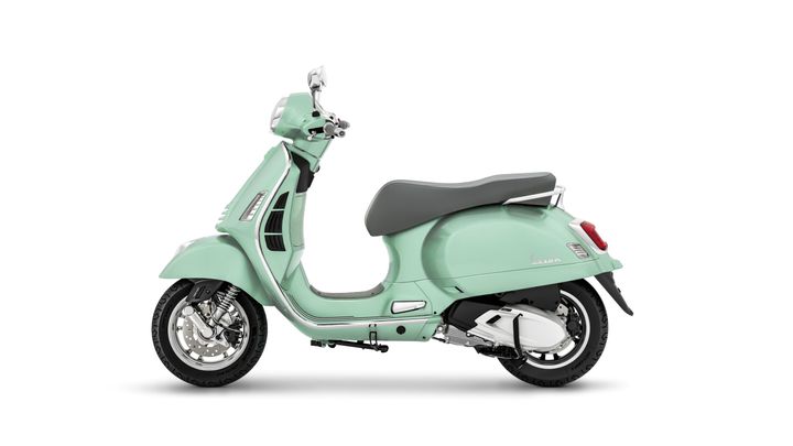 A vintage-style mint green scooter with a sleek design, featuring a grey seat, chrome accents, and a distinctive rounded shape. The scooter is displayed from the side against a plain white background.