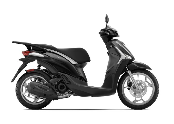 A sleek black scooter is shown in profile, featuring a comfortable seat, modern design elements, and a front disc brake.