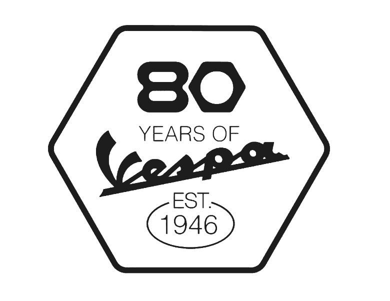 Logo celebrating 80 years of Vespa, featuring "80 YEARS OF Vespa" in stylized text with "EST 1946" in an oval below. The design is enclosed in a hexagonal shape.