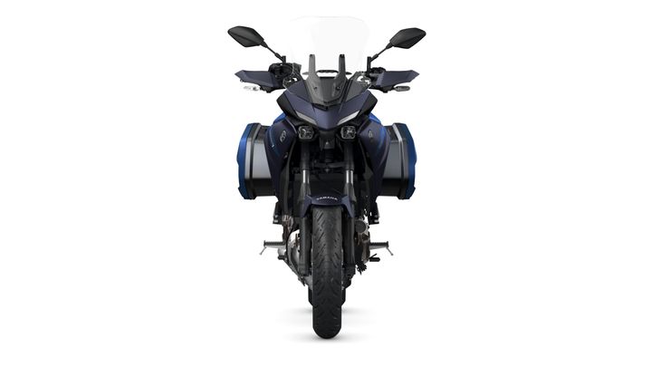 Front view of a Yamaha motorcycle with a sleek design, equipped with side panniers and dual headlights.