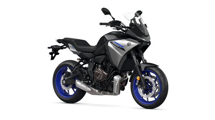 A sleek, modern motorcycle with a silver body, blue rims, and a sporty design, positioned at an angle to showcase its features.
