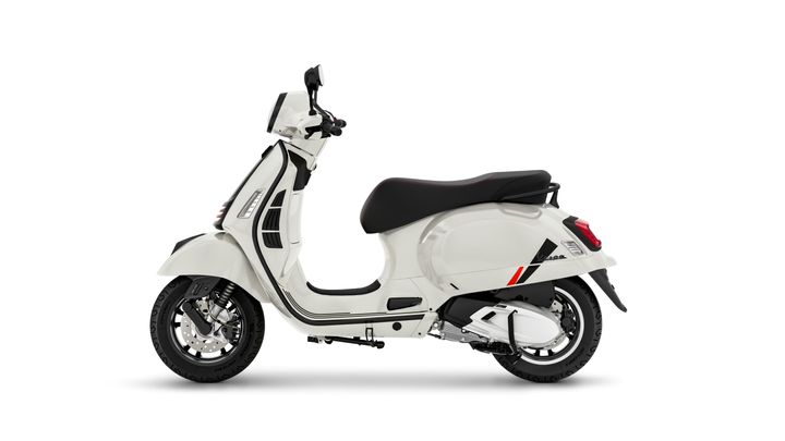 A white scooter with a sleek design, featuring a black seat and red accents, positioned on a plain background.