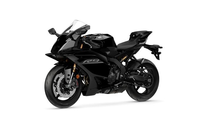 A sleek black motorcycle with a modern design, featuring sharp lines, a prominent front fairing, and an aerodynamic body. The bike has a high-performance look, showcasing its sports capabilities with alloy wheels and advanced braking system components.