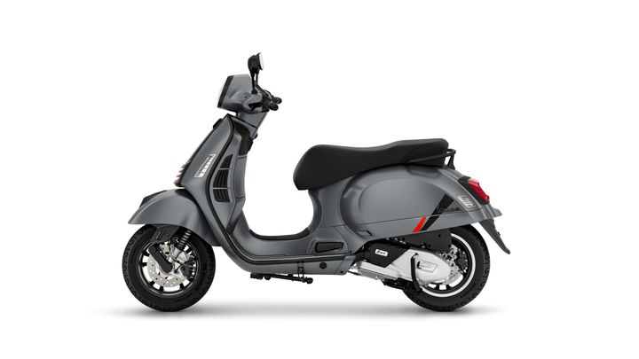 A sleek gray scooter with a black seat, viewed from the side.