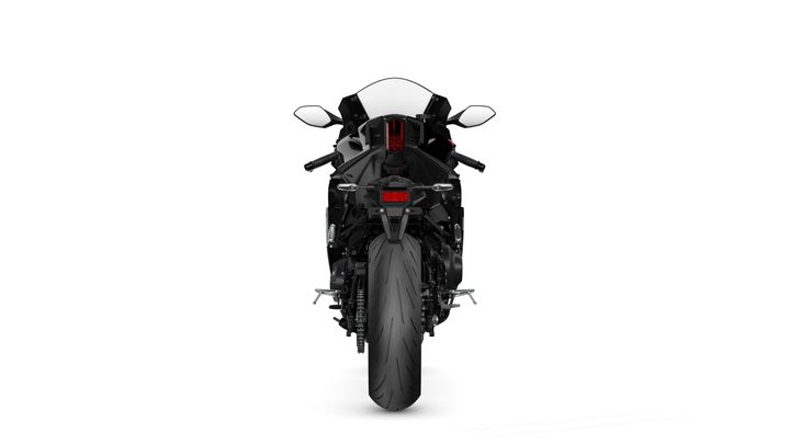 A sleek black sports motorcycle viewed from the rear, showcasing its tire, tail lights, and aerodynamic design against a plain white background.