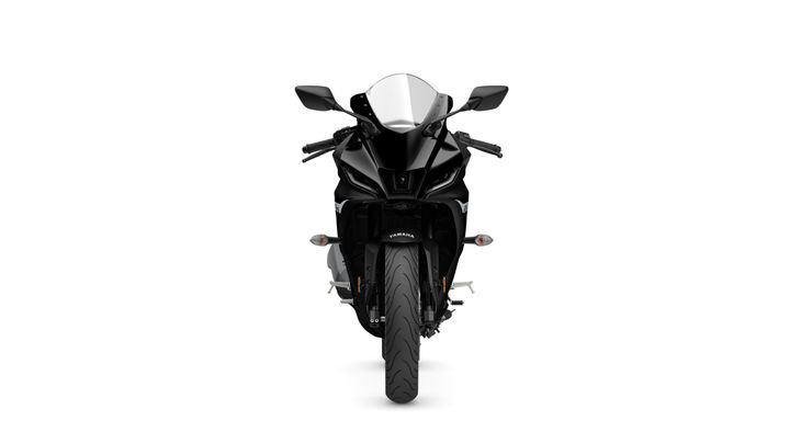 A sleek black sports motorcycle facing forward, featuring a windscreen, headlight, and aerodynamic design.