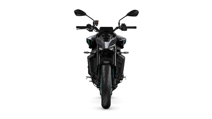 Front view of a sleek, modern motorcycle with a prominent front tire, distinct headlight design, and handlebars. The motorcycle features a matte black body with teal accents.