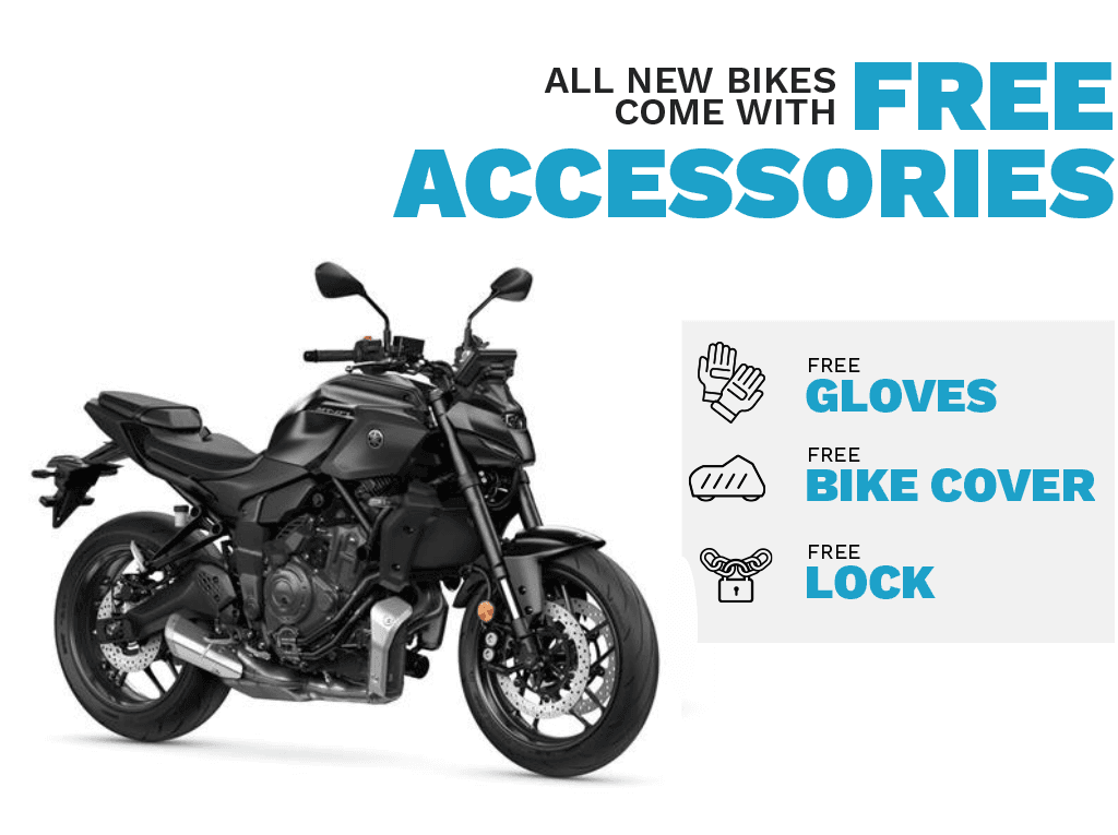 A black motorcycle is displayed prominently on the left, with promotional text on the right highlighting that all new bikes come with free accessories: gloves, a bike cover, and a lock.