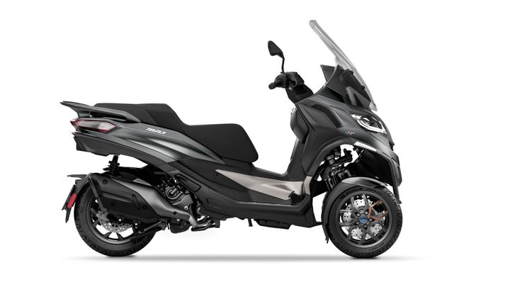 A modern black maxi scooter on a white background, showcasing its sleek design and side profile.