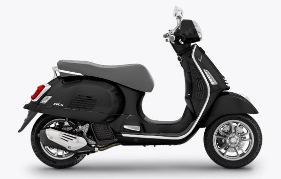 A black Vespa GTS scooter positioned in profile view against a white background.