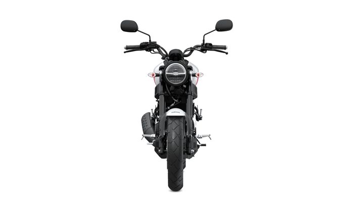 Front view of a black motorcycle with a round headlight, handlebars, and wide rear tire against a white background.
