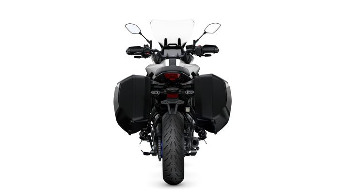 A rear view of a motorcycle with panniers, featuring a sleek design and a prominent rear tire, set against a white background.