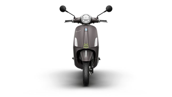 Front view of a sleek, modern scooter with a dark brown body, circular headlight, and minimalistic design elements.
