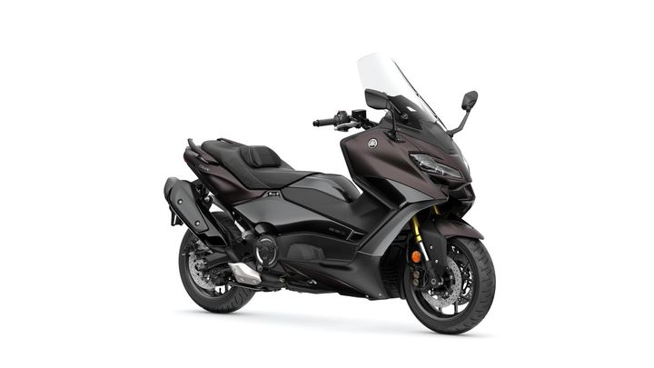 A sleek black Yamaha TMAX scooter with a windshield, showcasing its aerodynamic design, positioned at a slight angle on a white background.