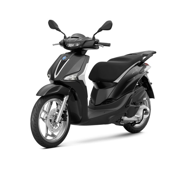 A sleek black scooter with a modern design, featuring a prominent front headlight, a comfortable seat, and stylish alloy wheels, positioned on a light background.