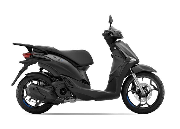 A sleek black scooter viewed from the side, featuring a modern design with a prominent seat, front mirror, and sporty wheels with blue accents.