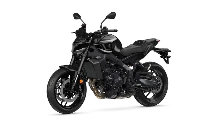 A sleek black motorcycle with a sporty design, featuring a low seating position, angular bodywork, and modern handlebars. The motorcycle is positioned at a slight angle, showcasing its front wheel and detailed engine components.