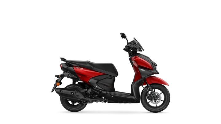 A sleek red and black scooter with a modern design, featuring a low seat, wide footrest, and prominent front fender, displayed against a plain white background.