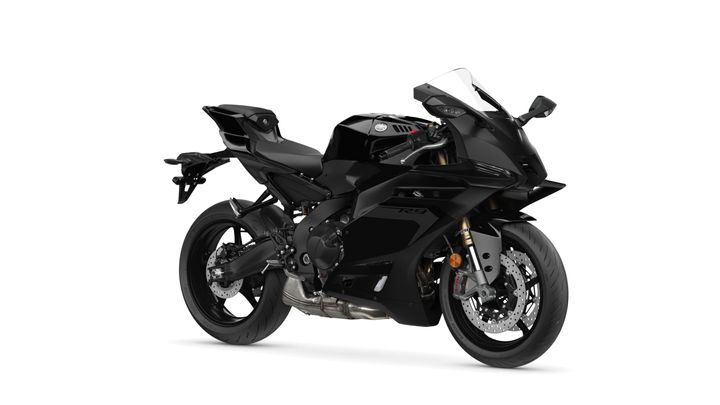 Yamaha 2025 R3 A sleek black sports motorcycle with aerodynamic design elements, featuring a high front fairing, sporty seat, and dual exhaust.