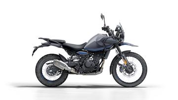 A modern black adventure motorcycle with spoked wheels positioned at a three-quarter angle on a white background.