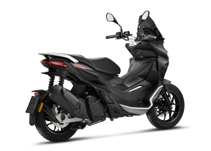 A modern black motor scooter with alloy wheels and visible branding positioned against a white background.