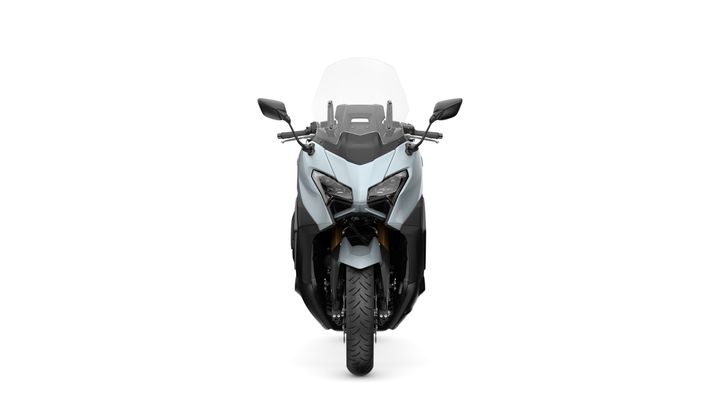 Front view of a sleek, modern motorcycle with a transparent windshield, dual headlights, and an angular design, set against a plain white background.
