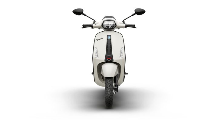 Front view of a sleek white scooter, featuring a modern design, prominent headlight, and stylish side mirrors, set against a white background.