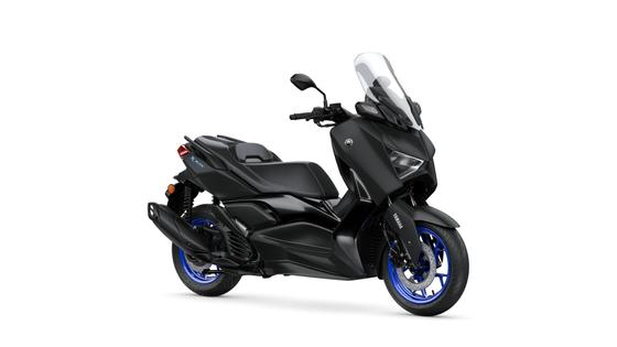A sleek black Yamaha XMAX scooter with blue accents, featuring a sporty design, a tall windscreen, and modern styling, positioned against a white background.