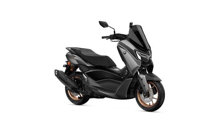 Yamaha 2026 NMAX 155 TECH MAX A sleek, modern scooter with a matte black finish and copper accents, featuring a tall windshield, a comfortable seat, and an advanced styling design.