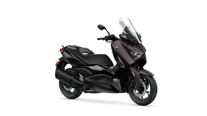 Yamaha 2024 XMAX 300 Tech MAX A sleek black Yamaha X-Max scooter, angled to showcase its modern design, windscreen, and stylish seat.