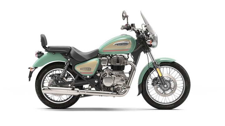 A green Royal Enfield Meteor 350 motorcycle positioned at a three-quarter angle against a white background.