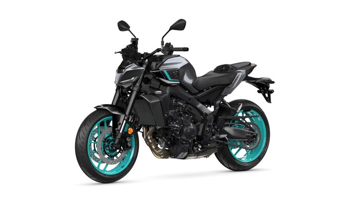 A modern motorcycle with a black and gray body, featuring turquoise accents on the wheels and trim, parked against a white background.