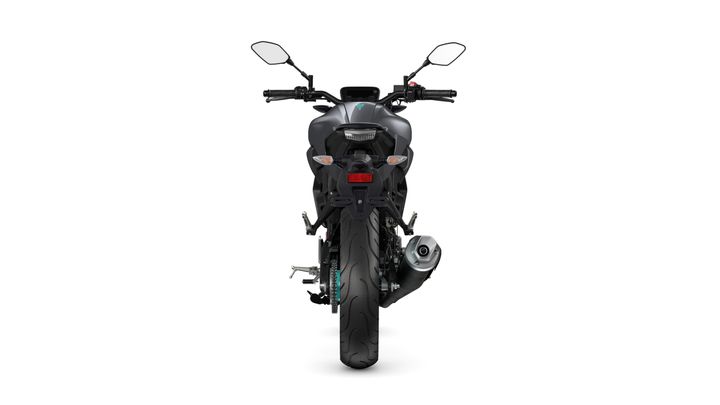 A sleek motorcycle viewed from the rear, featuring a dark matte finish, prominent taillights, side mirrors, and a silver exhaust pipe.