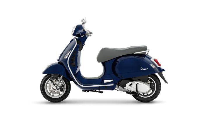 A navy blue Vespa scooter with a gray seat, shown from the side against a white background.