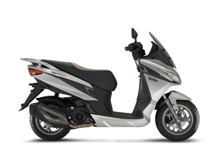 A silver Aprilia scooter on a white background.