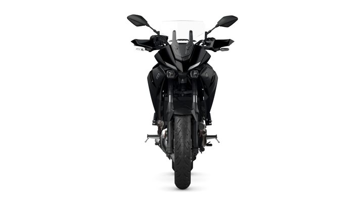 A front view of a sleek black motorcycle, displaying its dual headlights, aerodynamic design, and wide tires against a white background.