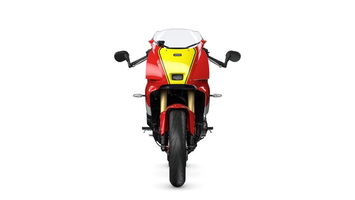 Front view of a red motorcycle with a yellow accent, featuring a sleek design, a windscreen, and black mirrors. The motorcycle has a prominent front tire and visible lighting elements.