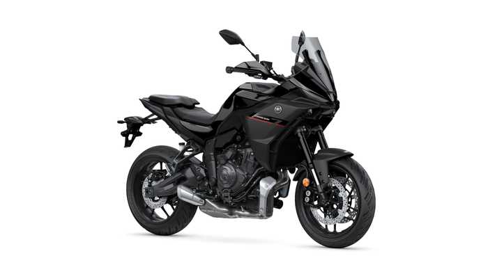 A sleek black motorcycle with a modern design, featuring a prominent front fairing, dual headlights, and a sporty frame, positioned at a slight angle.