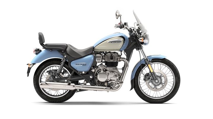 A Royal Enfield Meteor 350 motorcycle in blue and white color scheme, isolated on a white background.