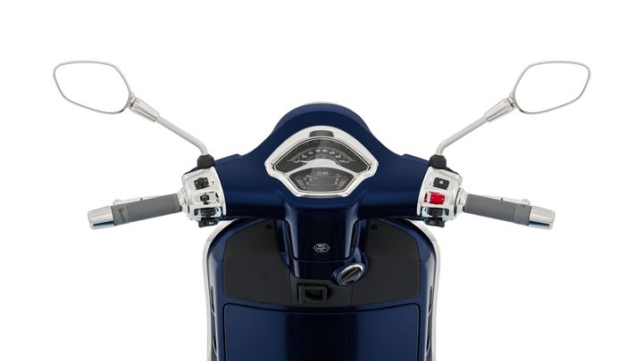 Close-up view of a scooter's handlebars, featuring a speedometer, controls, and mirrors, with a sleek blue design.