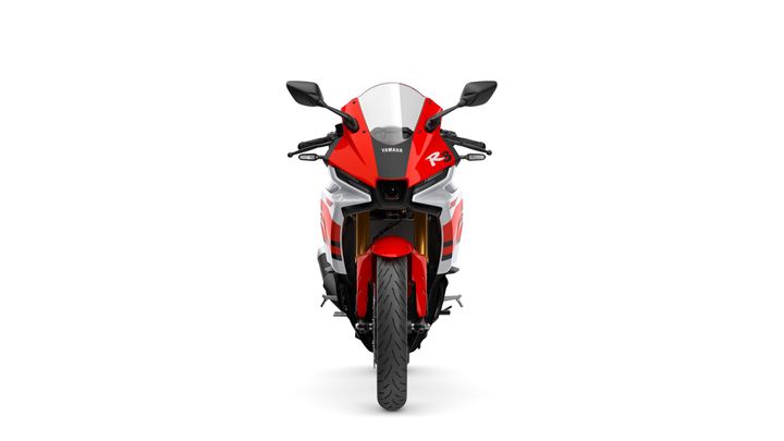 Front view of a red and white Yamaha motorcycle, featuring aerodynamic design elements and a sleek profile, prominently displaying the "R3" logo.