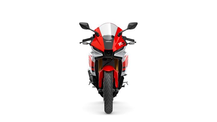 Front view of a red and white Yamaha motorcycle, featuring aerodynamic design elements and a sleek profile, prominently displaying the "R3" logo.