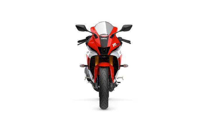 Front view of a red and white Yamaha R25 motorcycle against a white background.