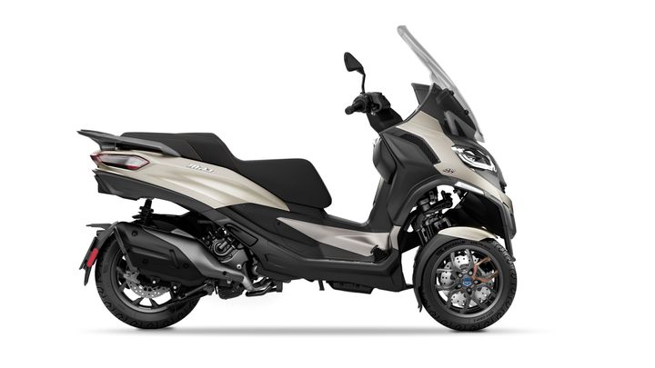 A modern maxi-scooter in a two-tone color scheme, displayed in profile view with a focus on its aerodynamic design and comfortable seating.