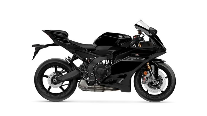 A sleek black sport motorcycle with a streamlined design, showcasing a modern fairing, prominent headlights, and detailed engine components, positioned against a white background.